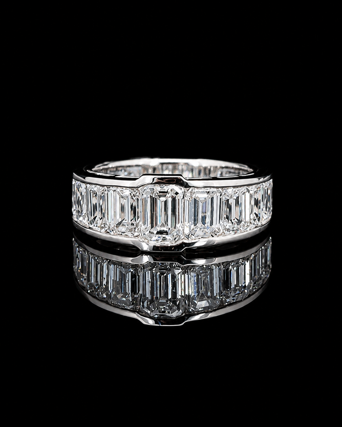 White gold 1.15ct emerald-cut ring with graduated lab grown diamond sides on black