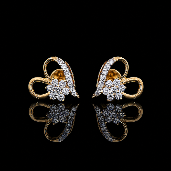 Yellow gold floral heart earrings with round lab grown diamonds photographed on black