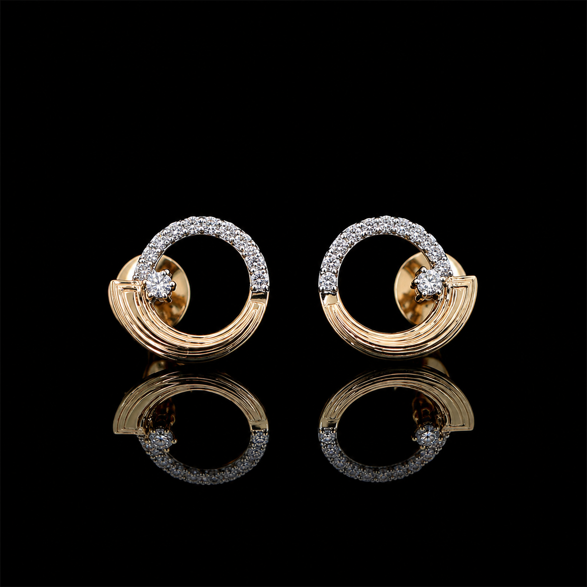 Yellow gold circular arc earrings with round lab grown diamonds photographed on black