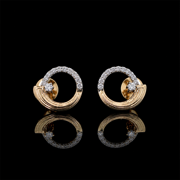 Yellow gold circular arc earrings with round lab grown diamonds photographed on black