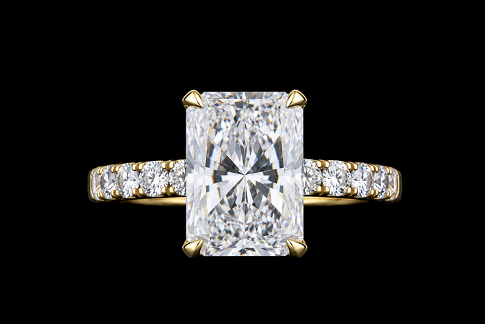 Yellow gold ring with 5.25ct radiant lab grown diamond and pavé diamond band on black
