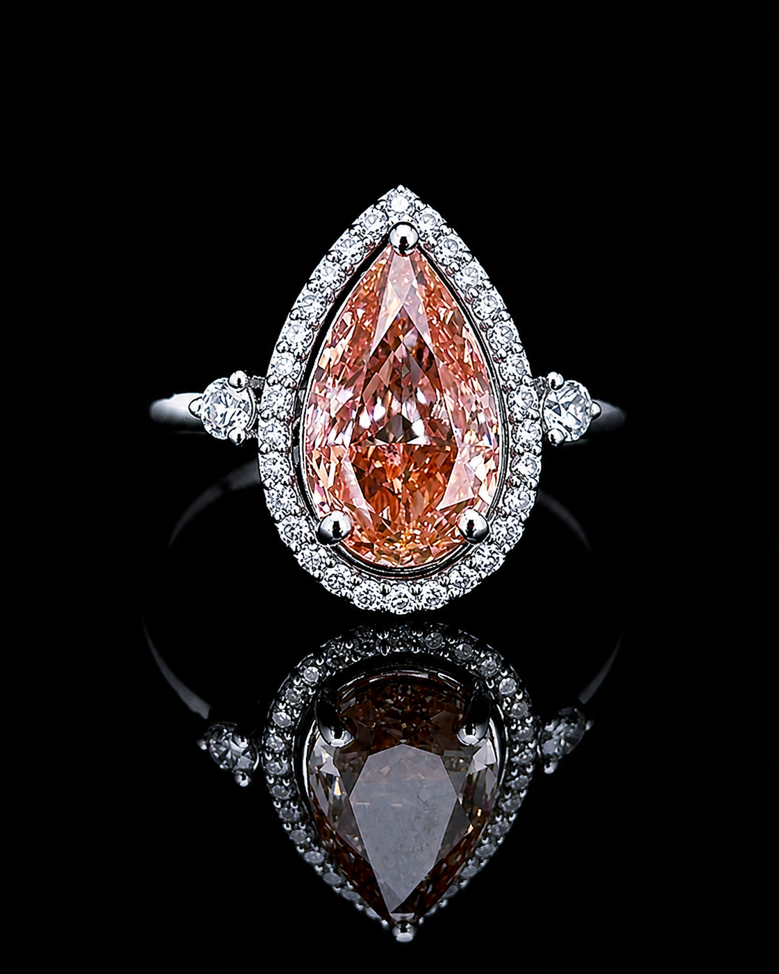 White gold 1.09ct pink pear double halo ring with lab grown diamonds on black
