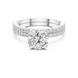 Round brilliant diamond ring with double pavé diamond band and four-prong solitaire setting