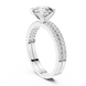 Round brilliant diamond ring with double pavé diamond band and four-prong solitaire setting