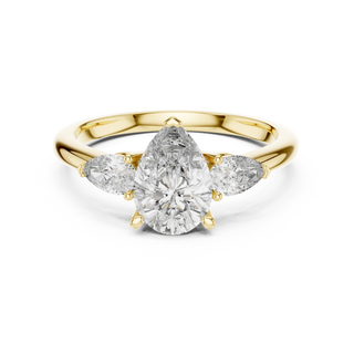 Pear lab grown diamond three stone engagement ring in yellow gold