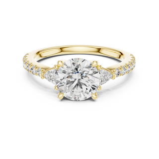 Round lab grown diamond three stone engagement ring in yellow gold