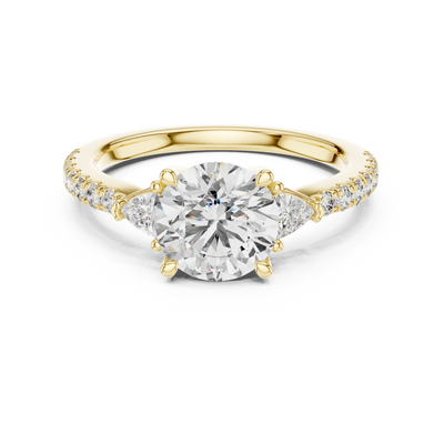 Round lab grown diamond three stone engagement ring in yellow gold