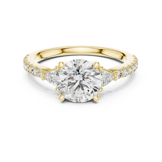 Round lab grown diamond three stone engagement ring in yellow gold
