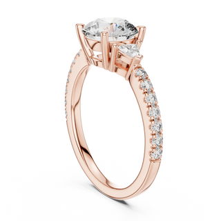 Round lab grown diamond three stone engagement ring in rose gold