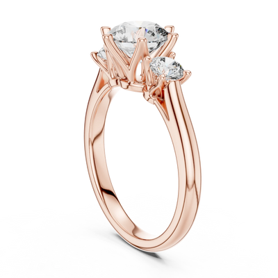 Round lab grown diamond three stone engagement ring in rose gold
