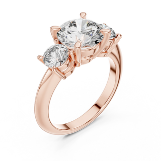 Round lab grown diamond three stone engagement ring in rose gold