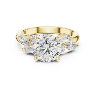 round lab grown diamond three-stone ring in yellow gold