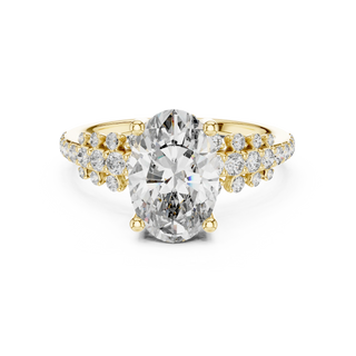 oval diamond split-shank engagement ring in yellow gold
