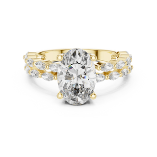 oval diamond marquise engagement ring in yellow gold
