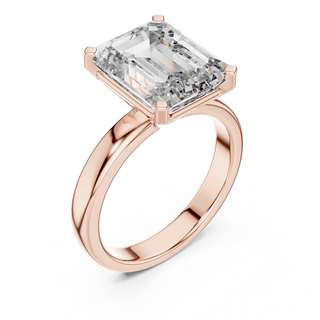 emerald diamond cathedral engagement ring in rose gold
