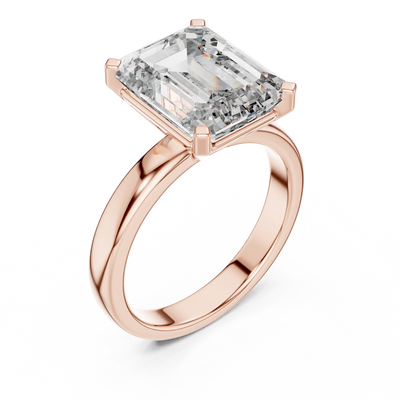 emerald diamond cathedral engagement ring in rose gold

