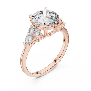 round diamond pear and round engagement ring in rose gold
