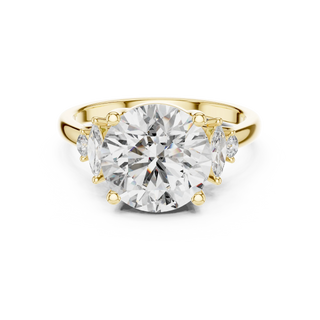 round diamond marquise side-stone ring in yellow gold
