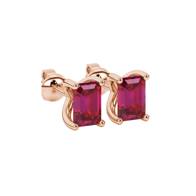 Emerald cut red gemstone solitaire stud earrings in rose gold four prong setting