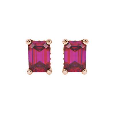 Red emerald cut gemstone stud earrings in rose gold four-prong setting