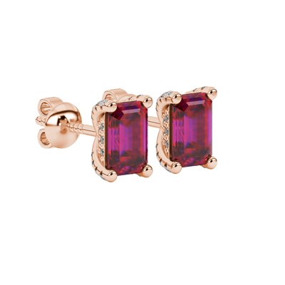 Red emerald cut gemstone stud earrings in rose gold four-prong setting