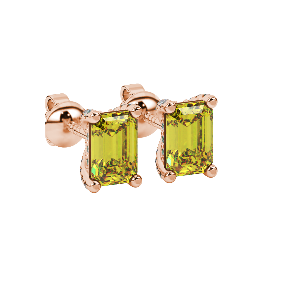 Yellow emerald cut gemstone stud earrings in yellow gold four-prong setting