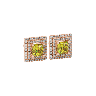 close-up shot of a princess-cut canary yellow gemstone earring with a rose gold falling edge diamond halo.
