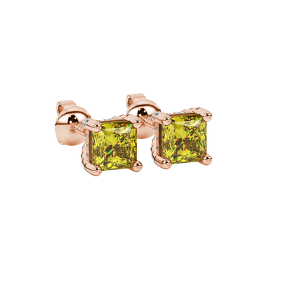 Close-up, princess canary yellow gemstone earrings, rose gold basket setting
