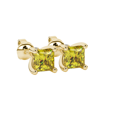 Close-up, princess canary yellow gemstone, yellow gold surprise earrings.