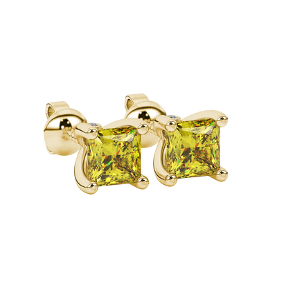 Close-up, princess canary yellow gemstone, yellow gold surprise earrings.