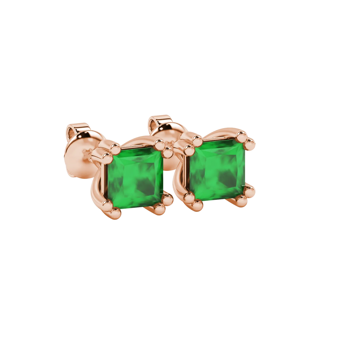 Close-up, princess emerald green gemstone earrings, rose gold vintage setting.
