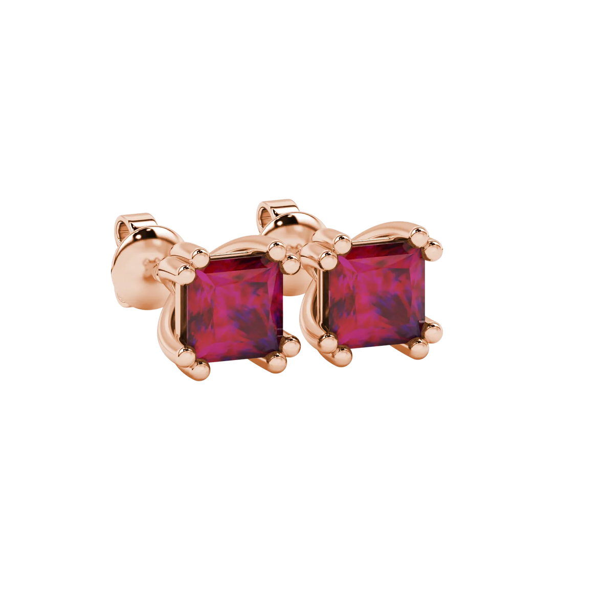 Close-up, princess raspberry red gemstone earrings, rose gold vintage setting.