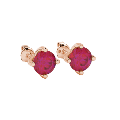 close-up shot of round raspberry red gemstone earrings with a rose gold four-prong design.