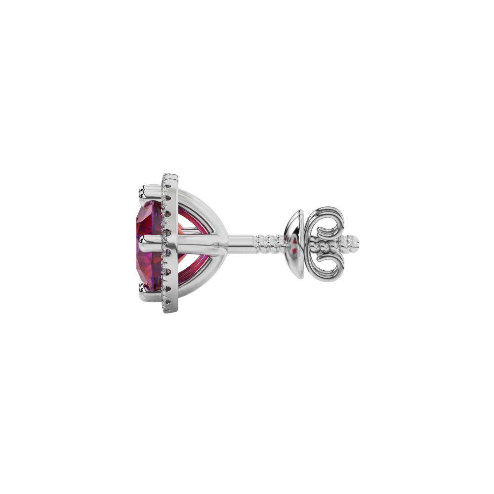 Side angle of white gold raspberry red gemstone stud earrings highlighting the French pavé halo details.