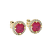 close-up of a round-cut raspberry red gemstone surrounded by a yellow gold diamond French pavé halo.
