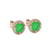 Close-up macro shot of round emerald green gemstone stud earrings with a rose gold diamond French pavé halo.