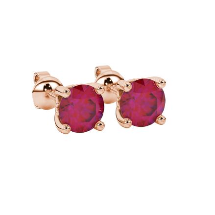 close-up shot of round raspberry red gemstone earrings with a rose gold lotus basket design