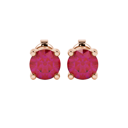 Round-cut raspberry red gemstone stud earrings in a rose gold surprise diamond setting.