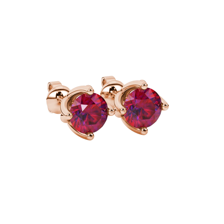 close-up shot of round raspberry red gemstone earrings with a rose gold tulip basket design