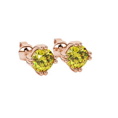 close-up of a round canary yellow gemstone with an intricate rose gold vintage basket setting.