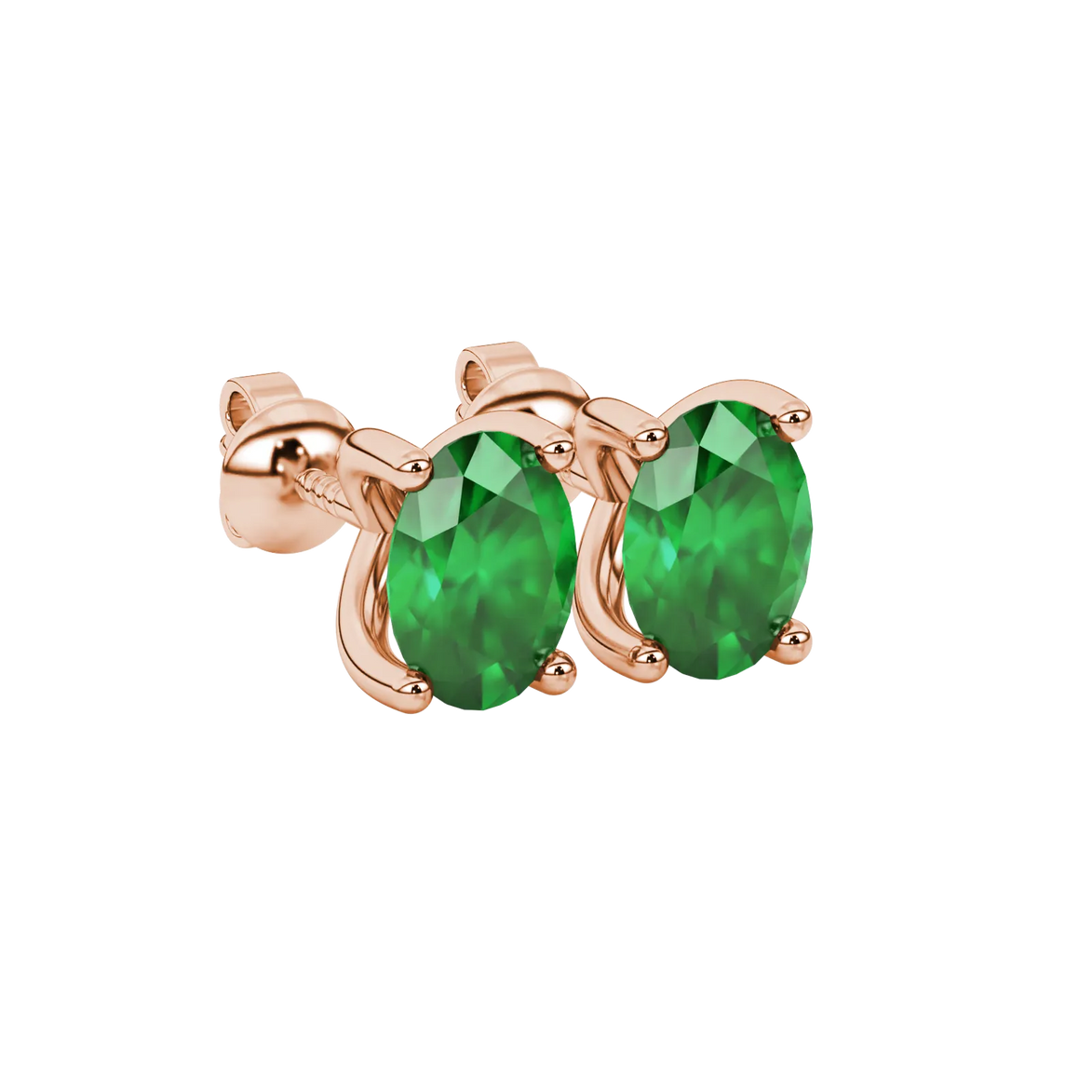 Close-up, oval cut emerald green gemstone earrings, rose gold four prong setting.