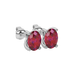 Close-up oval cut raspberry red gemstone earing, white gold four prong setting.