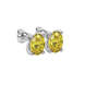Close-up oval cut canary yellow gemstone earing, white gold four prong setting.