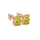 Close-up, oval cut canary yellow gemstone earrings, rose gold four prong setting.
