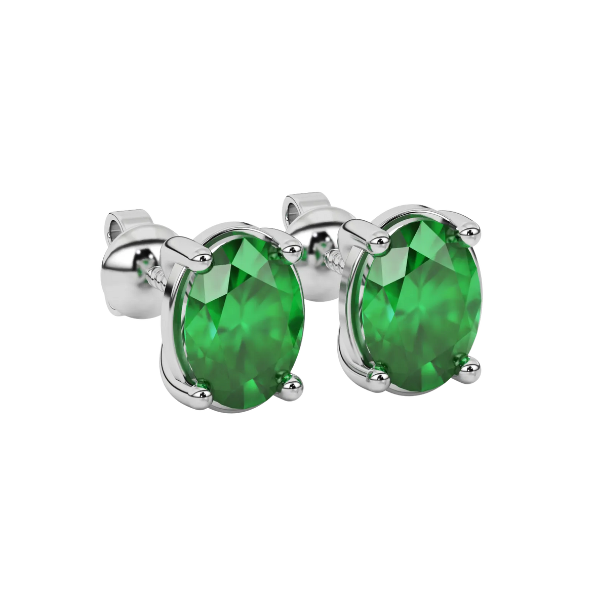 Close-up oval cut emerald green gemstone earing, white gold classic basket.
