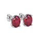 Close-up oval cut raspberry red gemstone earing, white gold classic basket.