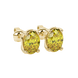 Close-up, oval cut canary yellow gemstone, yellow gold classic basket earrings.