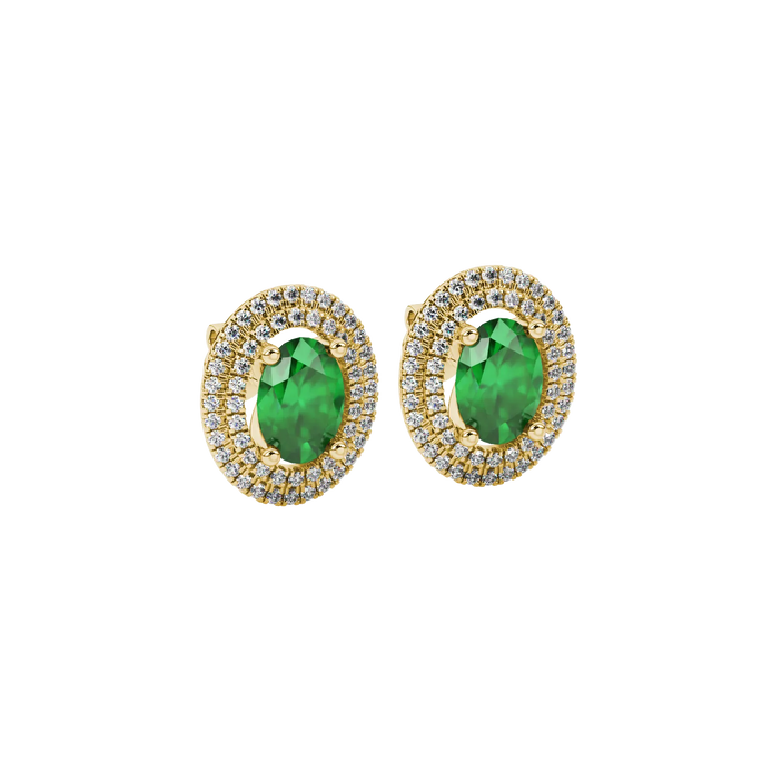 Close-up, oval cut emerald green gemstone, yellow gold falling edge halo earrings.