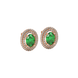 Close-up, oval cut emerald green gemstone earrings, rose gold double halo.