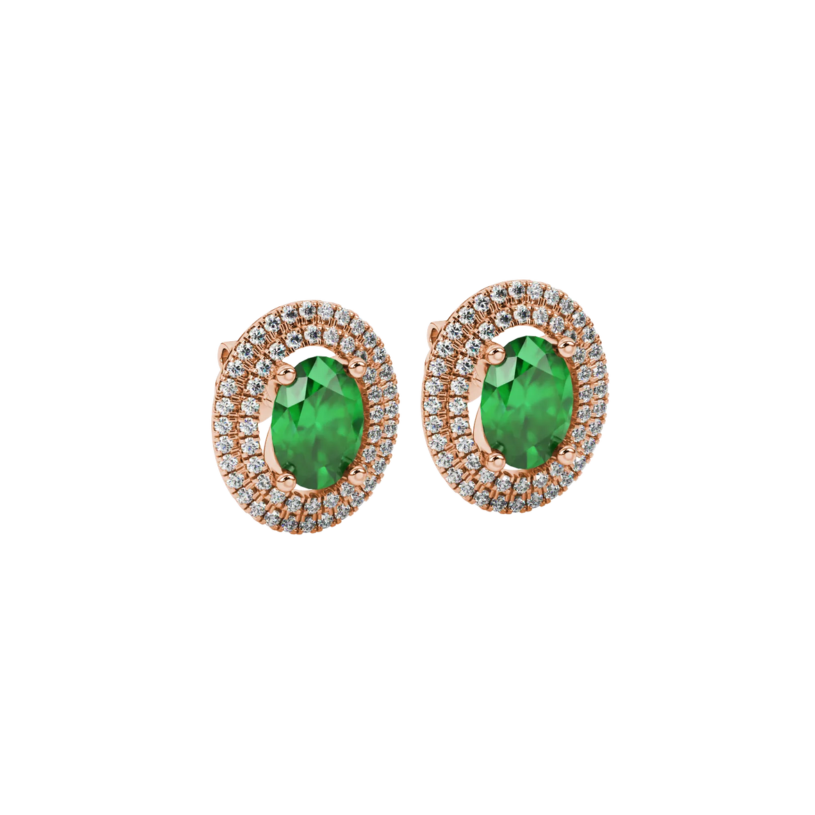Close-up, oval cut emerald green gemstone earrings, rose gold double halo.